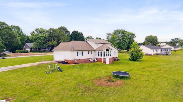 11 Midland Ct, Taylors, SC 29687 - back of property featuring a trampoline, crawl space, driveway, a lawn, and an attached garage
