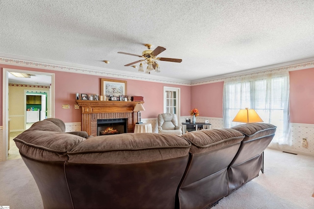 11 Midland Ct, Taylors, SC 29687 - living area featuring a ceiling fan, carpet flooring, a textured ceiling, a wainscoted wall, and a fireplace