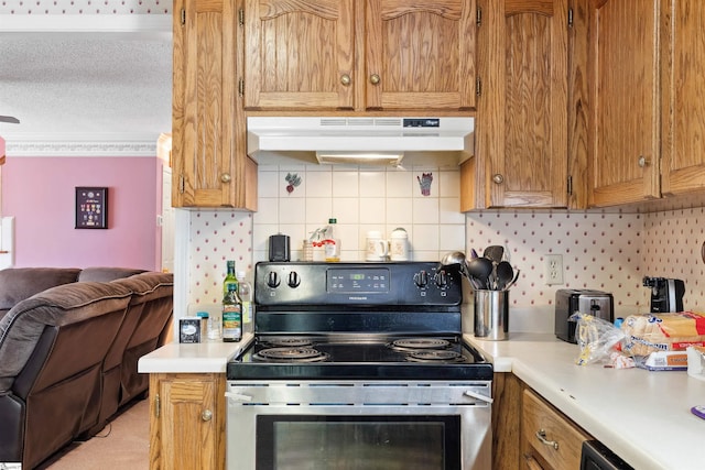 11 Midland Ct, Taylors, SC 29687 - kitchen with electric range, under cabinet range hood, open floor plan, light countertops, and a textured ceiling