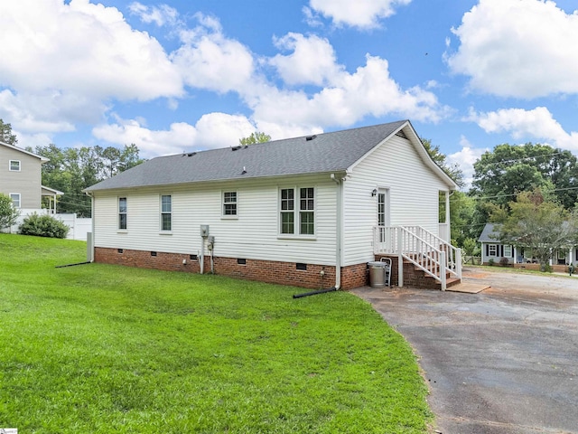 145 Hillside Cir, Easley, SC 29640 - back of property with crawl space, a shingled roof, a yard, and driveway