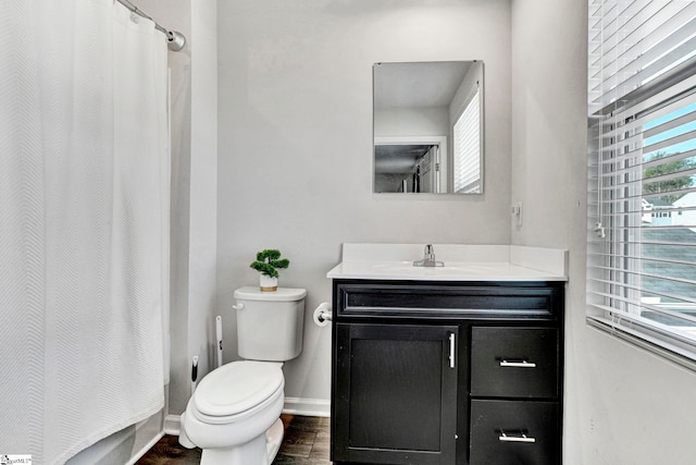709 Bolsover Way, Woodruff, SC 29388 - full bathroom featuring vanity, toilet, baseboards, wood finished floors, and a shower with shower curtain