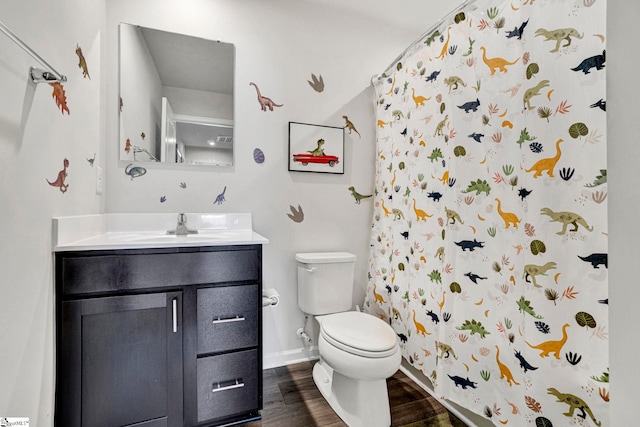 709 Bolsover Way, Woodruff, SC 29388 - full bath featuring toilet, vanity, wood finished floors, a shower with curtain, and baseboards