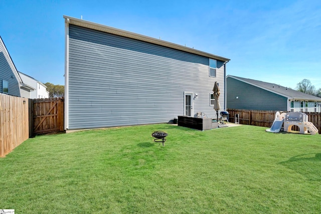 709 Bolsover Way, Woodruff, SC 29388 - rear view of property with an outdoor fire pit