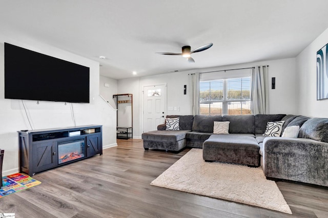 709 Bolsover Way, Woodruff, SC 29388 - living room featuring wood finished floors, a ceiling fan, and baseboards