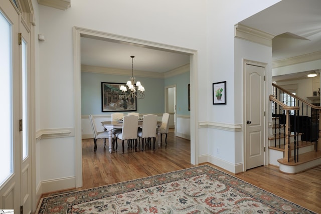 116 Legends Way, Simpsonville, SC 29681 - dining room with wood finished floors, crown molding, stairway, a chandelier, and baseboards