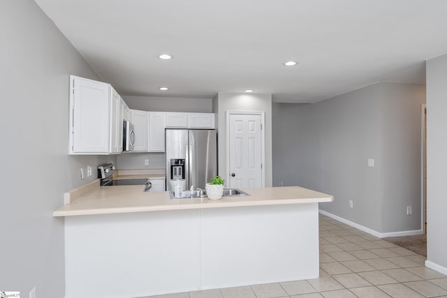 106 Felix Ct, Easley, SC 29640 - kitchen with appliances with stainless steel finishes, a peninsula, light countertops, white cabinetry, and baseboards