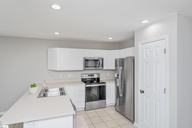 106 Felix Ct, Easley, SC 29640 - kitchen with appliances with stainless steel finishes, a sink, a peninsula, light countertops, and light tile patterned flooring