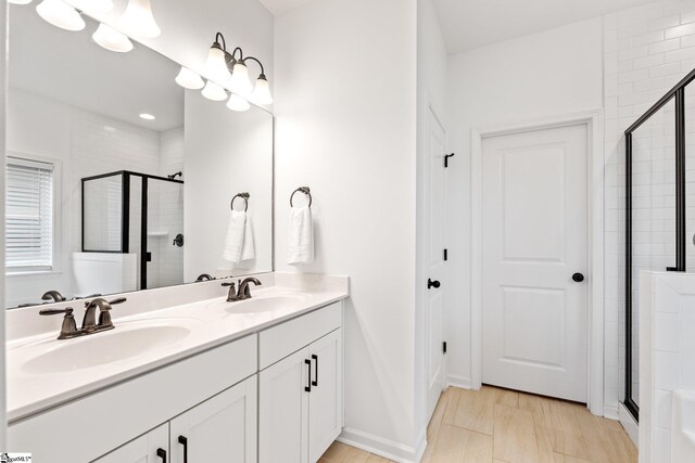 113 Noble St, Greer, SC 29651 - bathroom featuring a stall shower and double vanity