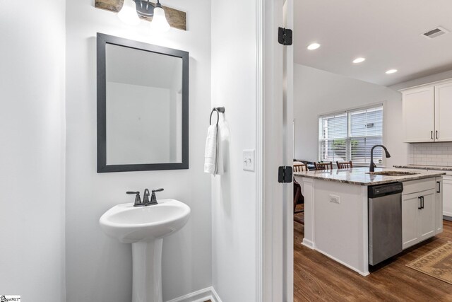 113 Noble St, Greer, SC 29651 - bathroom with a sink, wood finished floors, recessed lighting, tasteful backsplash, and baseboards