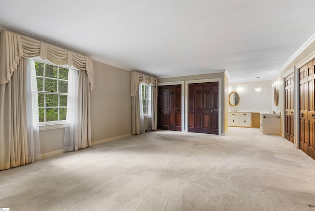 21 Kensington Rd, Greenville, SC 29617 - unfurnished living room with ornamental molding, carpet, and baseboards