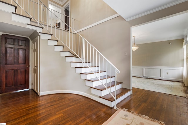 21 Kensington Rd, Greenville, SC 29617 - entryway with wood-type flooring, stairway, crown molding, a decorative wall, and a wainscoted wall
