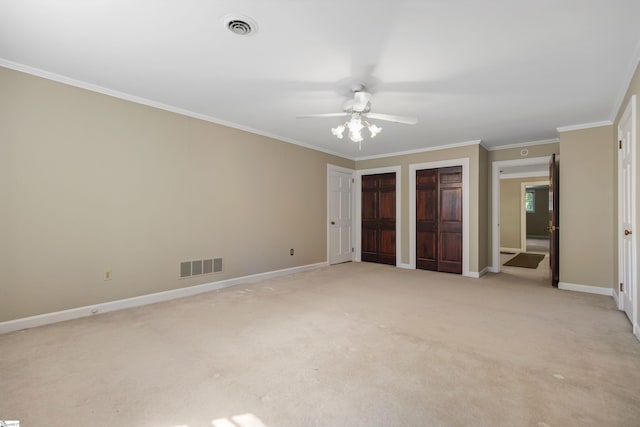 21 Kensington Rd, Greenville, SC 29617 - unfurnished bedroom with two closets, ornamental molding, baseboards, light colored carpet, and a ceiling fan