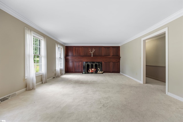 21 Kensington Rd, Greenville, SC 29617 - unfurnished living room with light colored carpet, ornamental molding, a warm lit fireplace, and baseboards