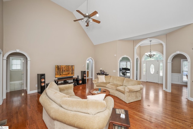 3 Swamp Lily Ct, Simpsonville, SC 29681 - living area featuring arched walkways, high vaulted ceiling, ceiling fan, wood finished floors, and a chandelier