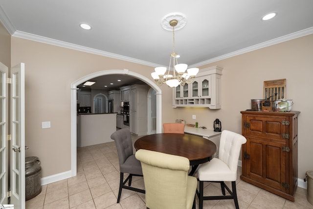 3 Swamp Lily Ct, Simpsonville, SC 29681 - dining area with arched walkways, ornamental molding, a chandelier, light tile patterned floors, and baseboards