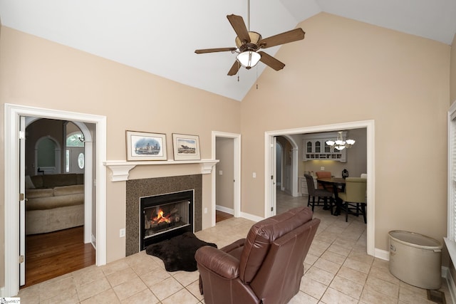 3 Swamp Lily Ct, Simpsonville, SC 29681 - living area featuring ceiling fan, high vaulted ceiling, a tile fireplace, light tile patterned flooring, and a chandelier