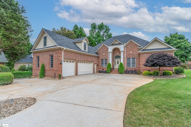 3 Swamp Lily Ct, Simpsonville, SC 29681 - view of front of property with brick siding, driveway, a front lawn, an attached garage, and a shingled roof