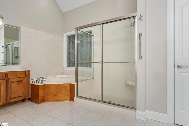 3 Swamp Lily Ct, Simpsonville, SC 29681 - bathroom featuring tile patterned floors, a shower stall, a garden tub, vanity, and vaulted ceiling