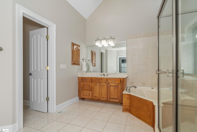 3 Swamp Lily Ct, Simpsonville, SC 29681 - bathroom featuring tile patterned flooring, vanity, a bath, a shower stall, and vaulted ceiling