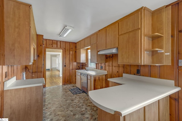 611 E S 6th St, Seneca, SC 29678 - kitchen with wooden walls, a sink, dishwasher, under cabinet range hood, and light countertops