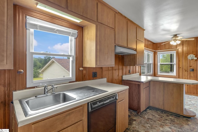 611 E S 6th St, Seneca, SC 29678 - kitchen with dishwasher, a sink, wooden walls, under cabinet range hood, and light countertops