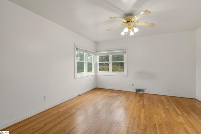 611 E S 6th St, Seneca, SC 29678 - empty room featuring light wood-style flooring, a ceiling fan, and baseboards