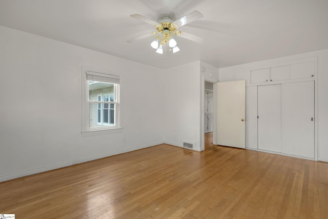 611 E S 6th St, Seneca, SC 29678 - unfurnished bedroom with light wood-type flooring, a closet, and baseboards
