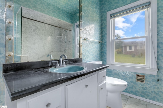 611 E S 6th St, Seneca, SC 29678 - bathroom with vanity, wallpapered walls, toilet, marble finish flooring, and baseboards