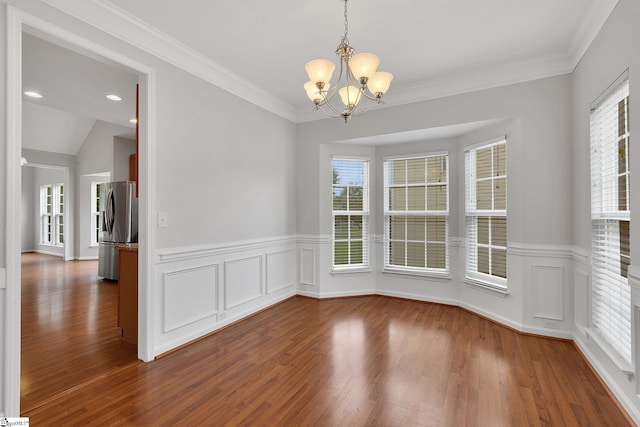 100 Beason Farm Ln, Simpsonville, SC 29681 - unfurnished dining area featuring a chandelier, wood finished floors, a wainscoted wall, and ornamental molding
