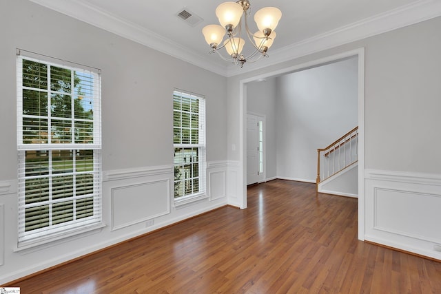 100 Beason Farm Ln, Simpsonville, SC 29681 - unfurnished dining area featuring a chandelier, stairway, wood finished floors, crown molding, and a wainscoted wall