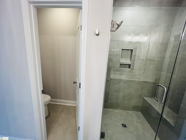 47 Hensley Rd Unit 58, Greenville, SC 29607 - full bath featuring a shower stall, toilet, tile patterned flooring, and baseboards