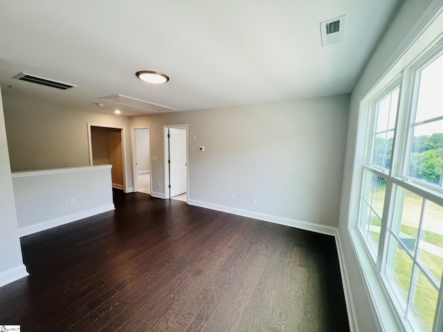 47 Hensley Rd Unit 58, Greenville, SC 29607 - spare room featuring attic access, dark wood finished floors, and baseboards