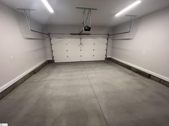47 Hensley Rd Unit 58, Greenville, SC 29607 - garage with a garage door opener and baseboards