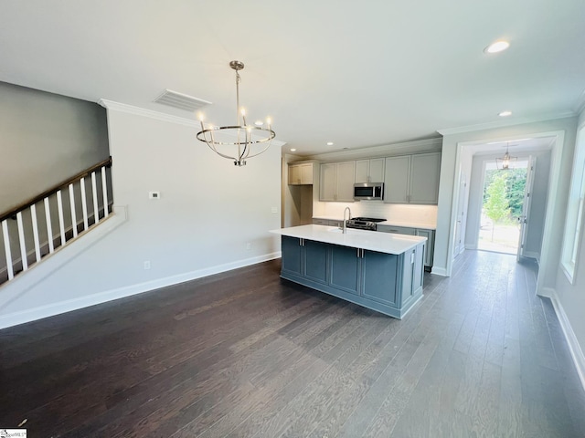 47 Hensley Rd Unit 58, Greenville, SC 29607 - kitchen with stainless steel appliances, a chandelier, crown molding, baseboards, and light countertops