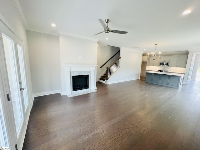 47 Hensley Rd Unit 58, Greenville, SC 29607 - unfurnished living room featuring ornamental molding, recessed lighting, baseboards, a chandelier, and dark wood finished floors