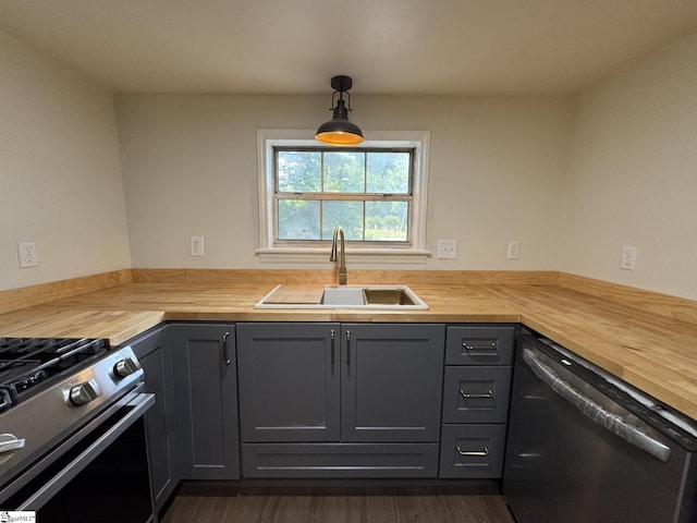 800 W Hampton St, Laurens, SC 29360 - kitchen featuring wooden counters, stainless steel appliances, a sink, and gray cabinetry