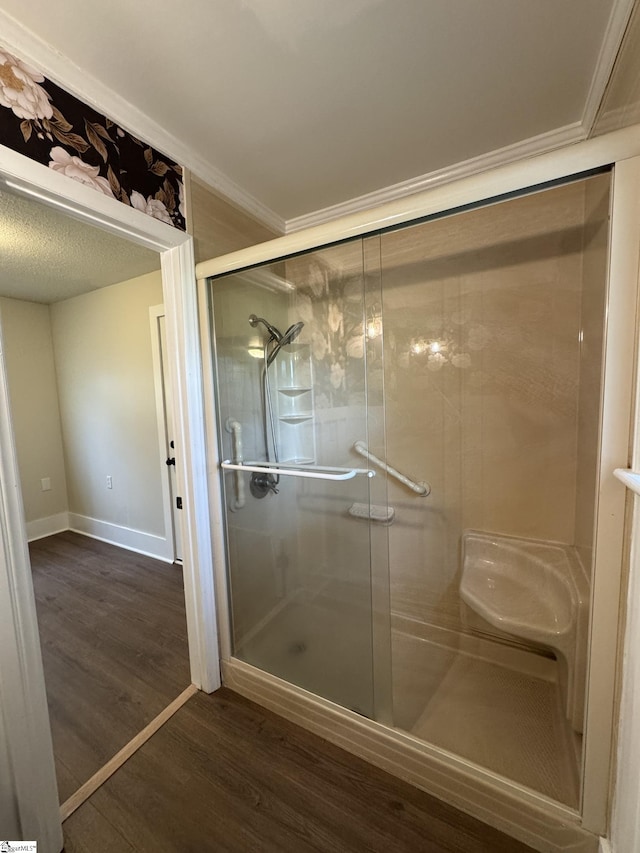 800 W Hampton St, Laurens, SC 29360 - full bath featuring wood finished floors, a stall shower, baseboards, and ornamental molding
