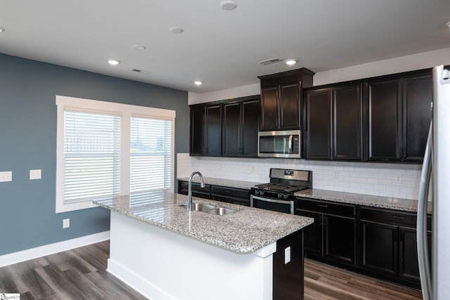 108 Pewter Cir, Simpsonville, SC 29680 - kitchen featuring stainless steel appliances, a sink, backsplash, dark wood-type flooring, and recessed lighting