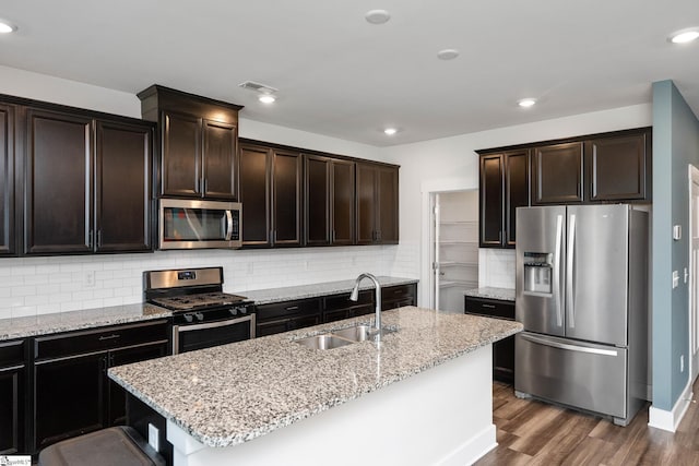 108 Pewter Cir, Simpsonville, SC 29680 - kitchen featuring appliances with stainless steel finishes, a sink, dark wood-type flooring, light stone countertops, and recessed lighting
