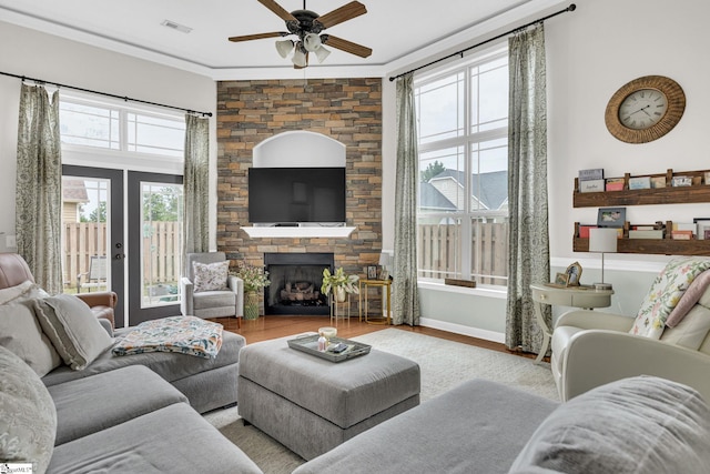 204 Medoc Ln, Moore, SC 26369 - living area featuring a ceiling fan, wood finished floors, a stone fireplace, ornamental molding, and baseboards