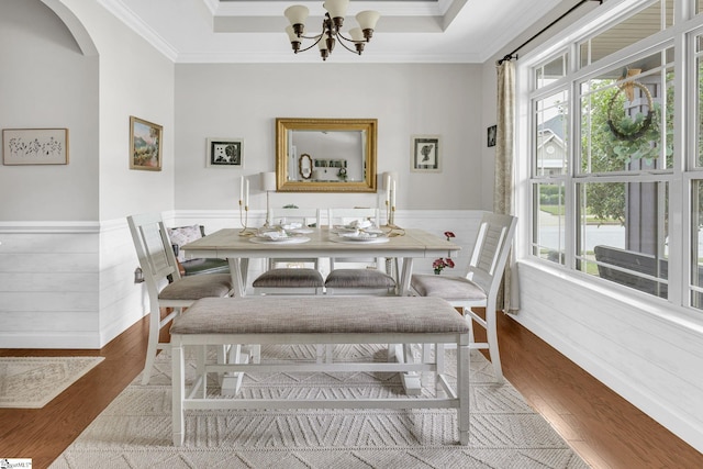 204 Medoc Ln, Moore, SC 26369 - dining area with wood finished floors, crown molding, arched walkways, wainscoting, and a chandelier