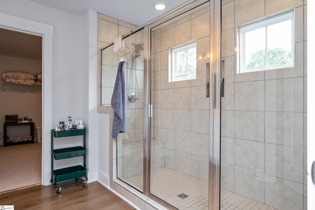 800 Redmill Ln, Duncan, SC 29334 - bathroom featuring wood finished floors, a shower stall, a walk in closet, baseboards, and recessed lighting
