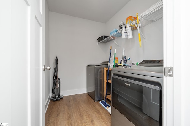 800 Redmill Ln, Duncan, SC 29334 - laundry room featuring independent washer and dryer, wood finished floors, and baseboards