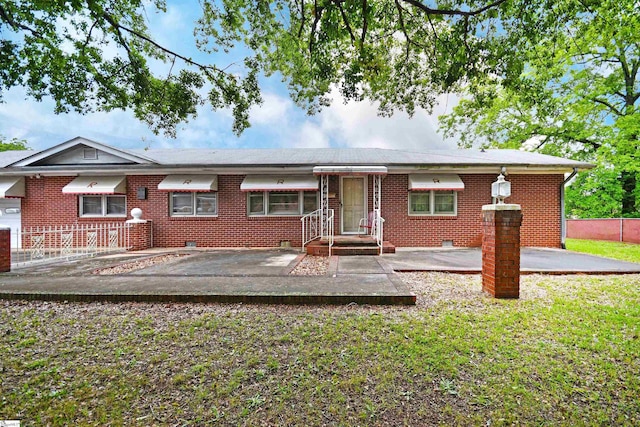 5 E Church St, Williamston, SC 29697 - view of front of property with brick siding, a front lawn, and a patio