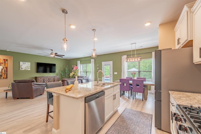 345 Cypress Hollow Trl, Piedmont, SC 29673 - kitchen with stainless steel appliances, a sink, light wood finished floors, white cabinets, and recessed lighting