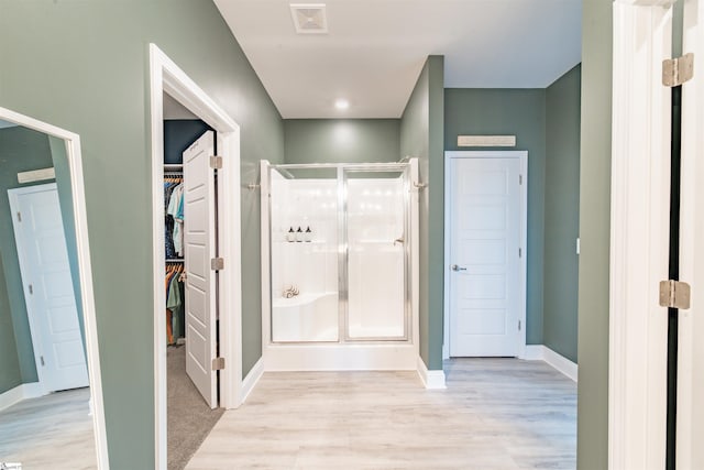 345 Cypress Hollow Trl, Piedmont, SC 29673 - full bath with a stall shower, baseboards, wood finished floors, and a spacious closet