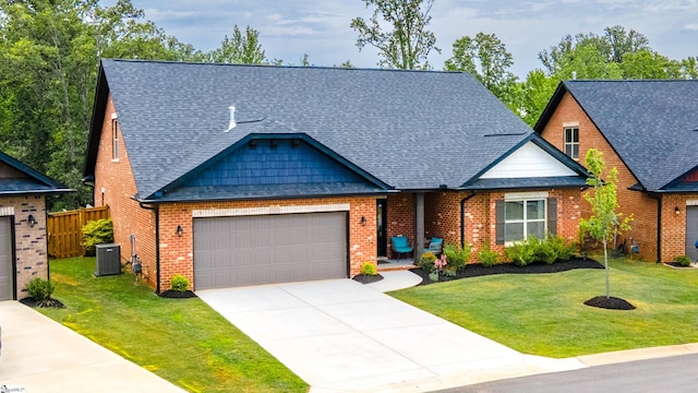 345 Cypress Hollow Trl, Piedmont, SC 29673 - view of front facade with a garage, a shingled roof, driveway, brick siding, and central air condition unit