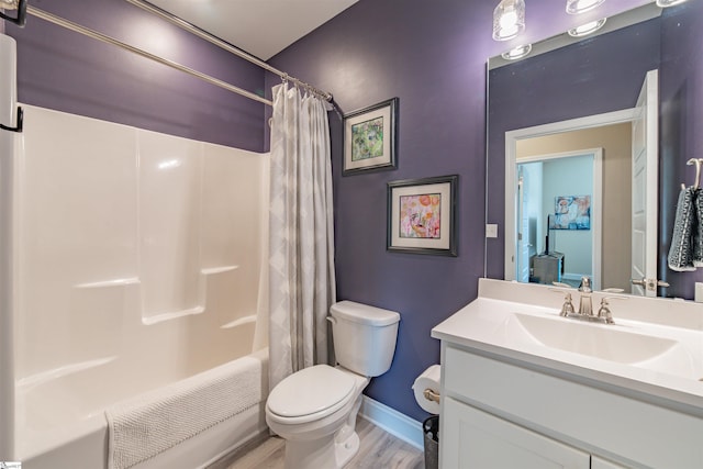 345 Cypress Hollow Trl, Piedmont, SC 29673 - bathroom with wood finished floors, baseboards, toilet, vanity, and shower / tub combo with curtain