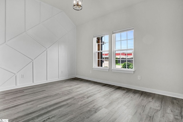 1708 Old Georgia Hwy, Gaffney, SC 29341 - bonus room with plenty of natural light, wood finished floors, a chandelier, and vaulted ceiling