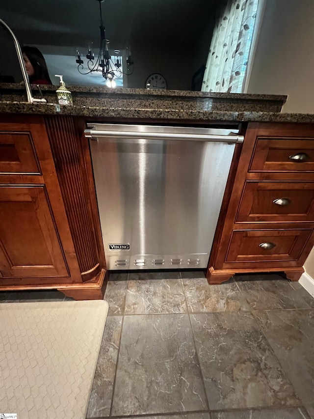 9 Lee St, Liberty, SC 29657 - kitchen view of stainless steel dishwasher, a chandelier, and dark stone countertops